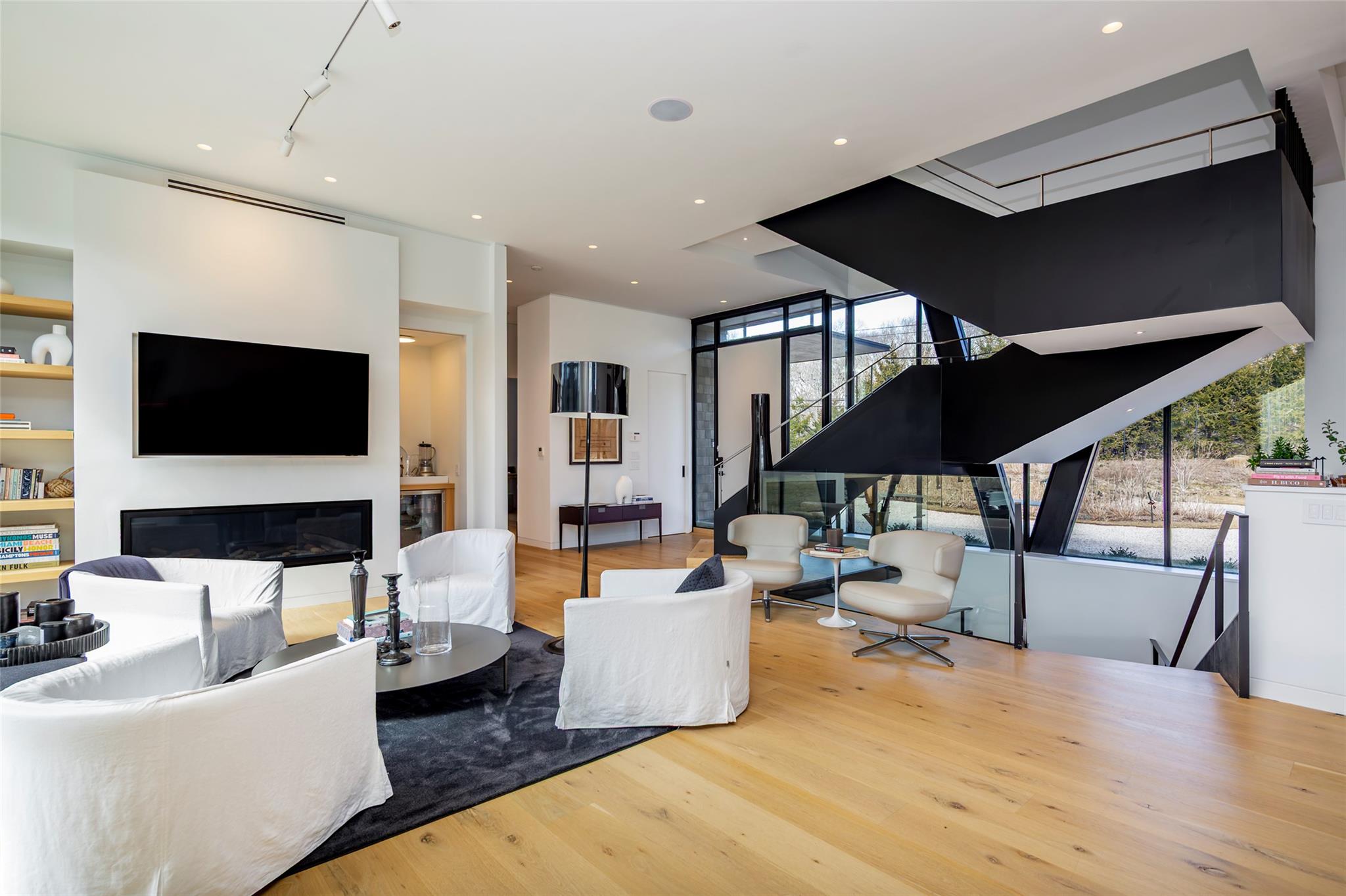 179 Montauk Highway East Hampton, NY 11937 - Photo 19 of 47 a living room with furniture and a flat screen tv