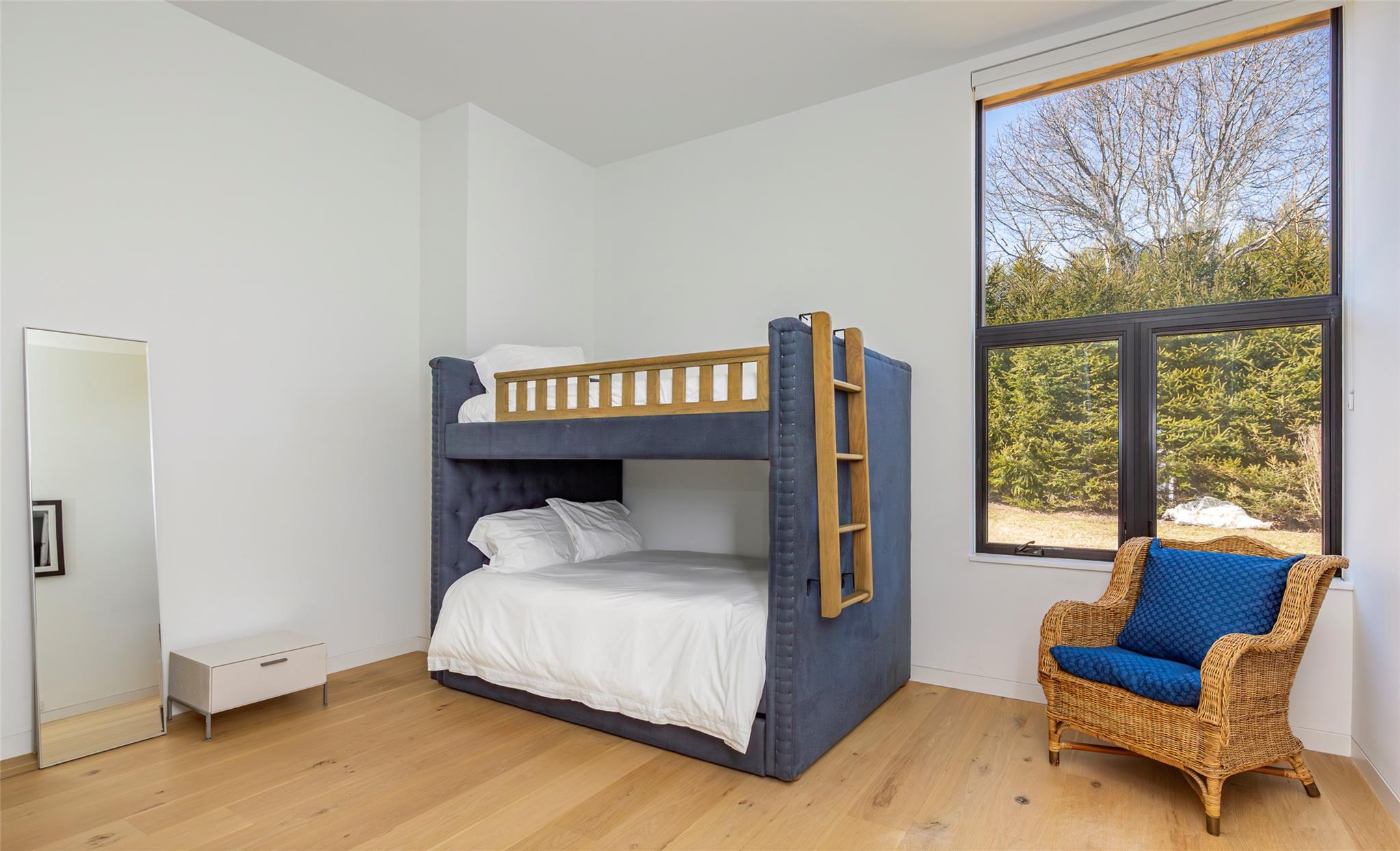 179 Montauk Highway East Hampton, NY 11937 - Photo 26 of 47 a bed sitting in a bedroom next to a window