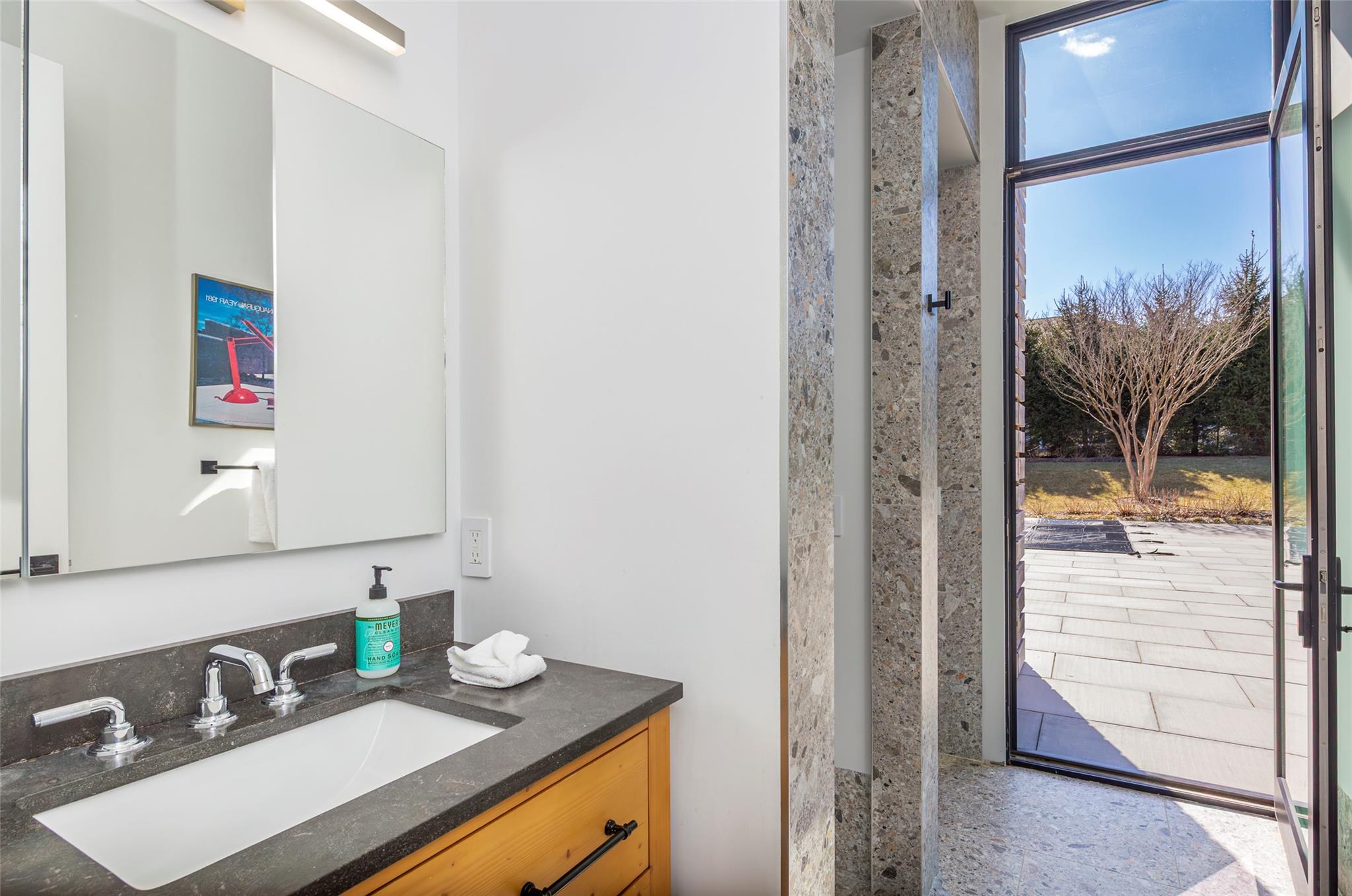 179 Montauk Highway East Hampton, NY 11937 - Photo 27 of 47 a bathroom with a sink and a mirror