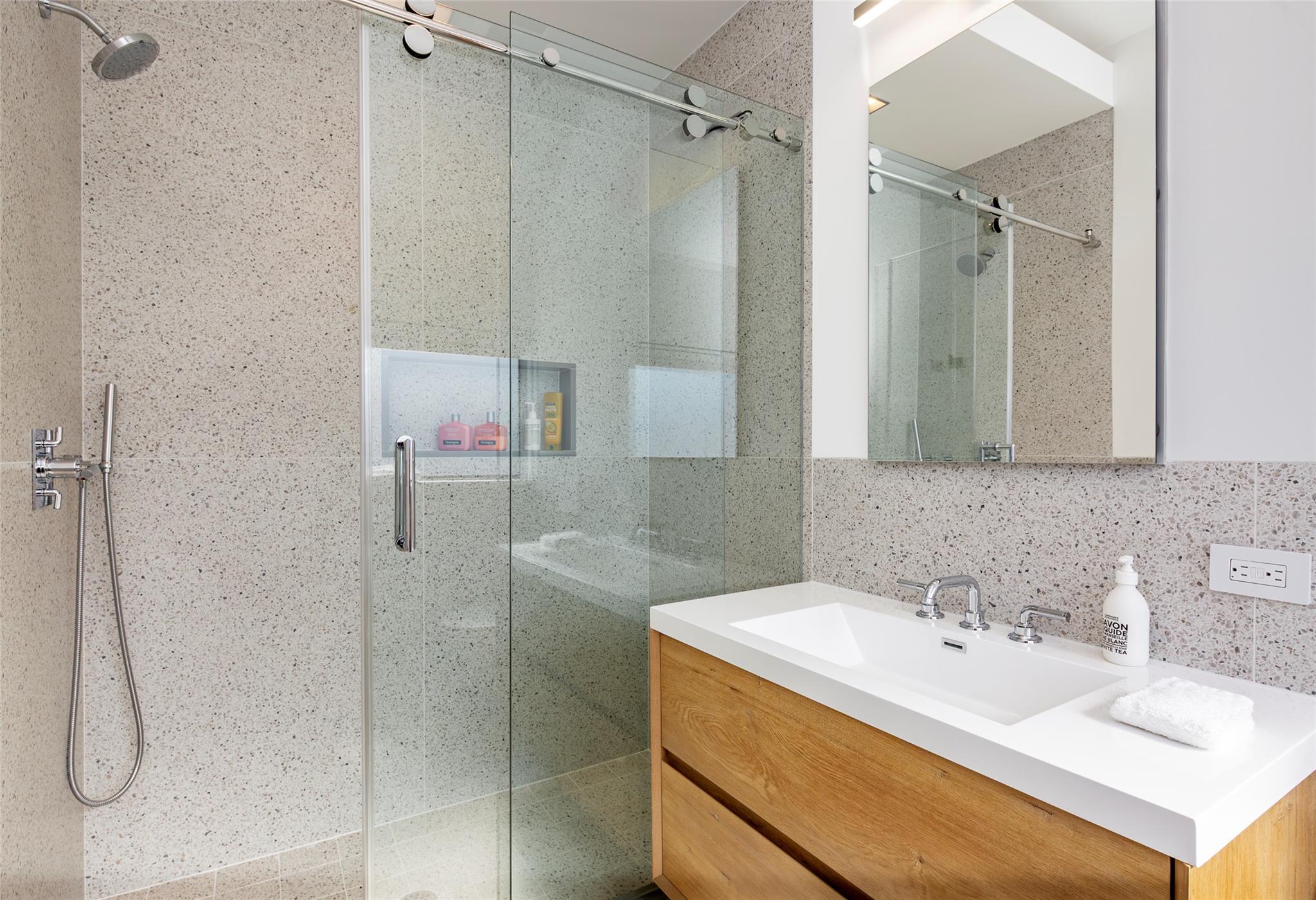 179 Montauk Highway East Hampton, NY 11937 - Photo 35 of 47 a bathroom with a sink and mirror