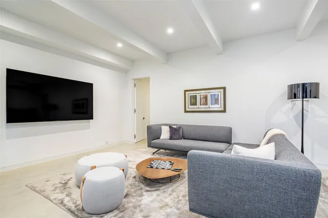 a bedroom with a bed and a painting