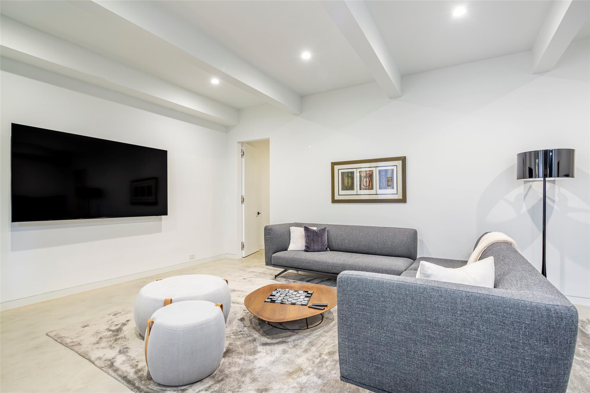 179 Montauk Highway East Hampton, NY 11937 - Photo 38 of 47 a living room with furniture and a flat screen tv