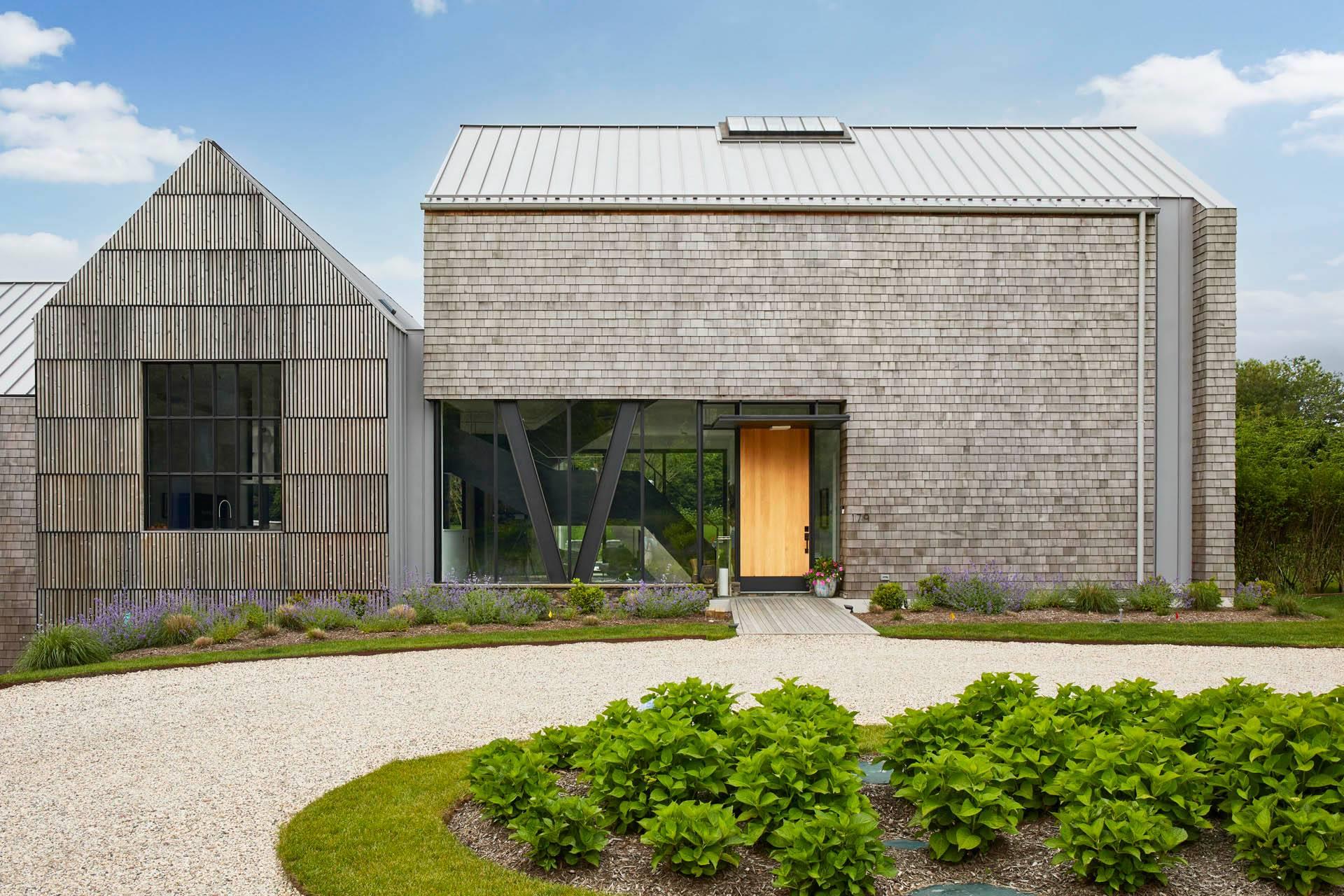 179 Montauk Highway East Hampton, NY 11937 - Photo 4 of 47 a front view of a house with a yard