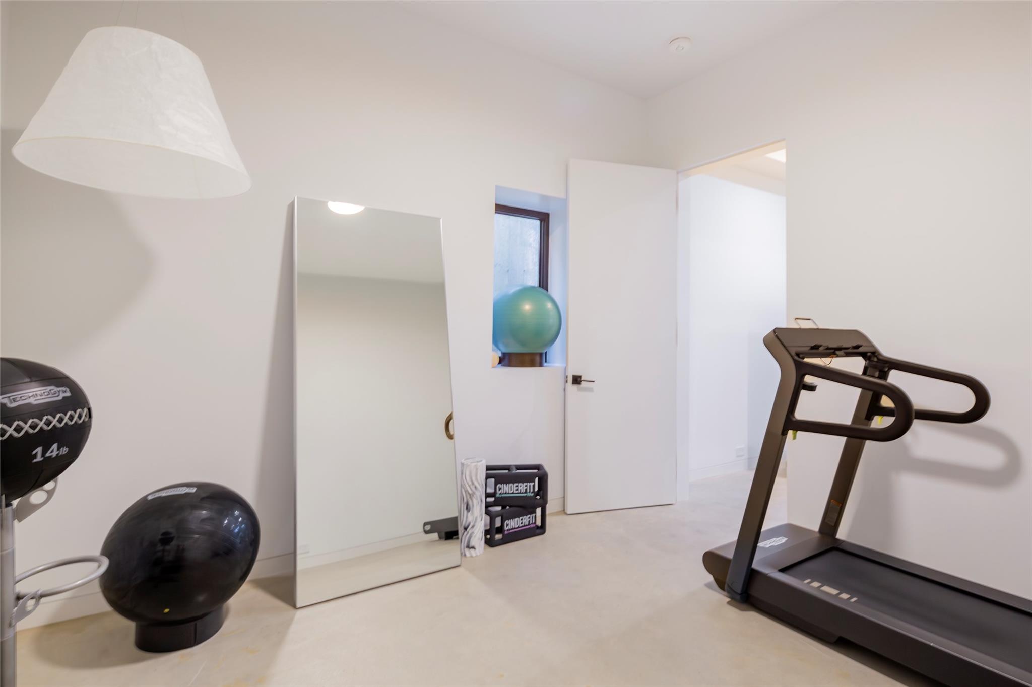 179 Montauk Highway East Hampton, NY 11937 - Photo 41 of 47 a view of a room with gym equipment
