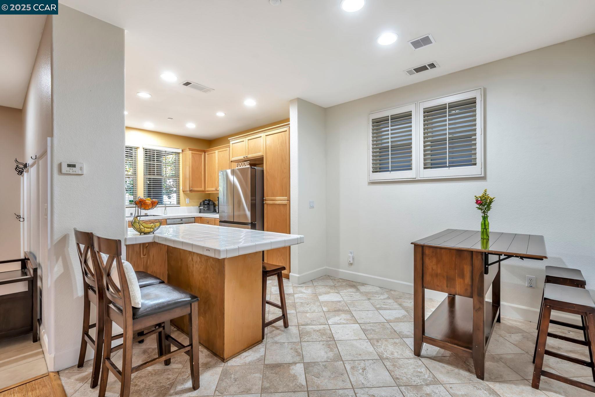 2036 Serra Lane Hercules, CA 94547 - Photo 13 of 60 a kitchen that has a table and chairs in it