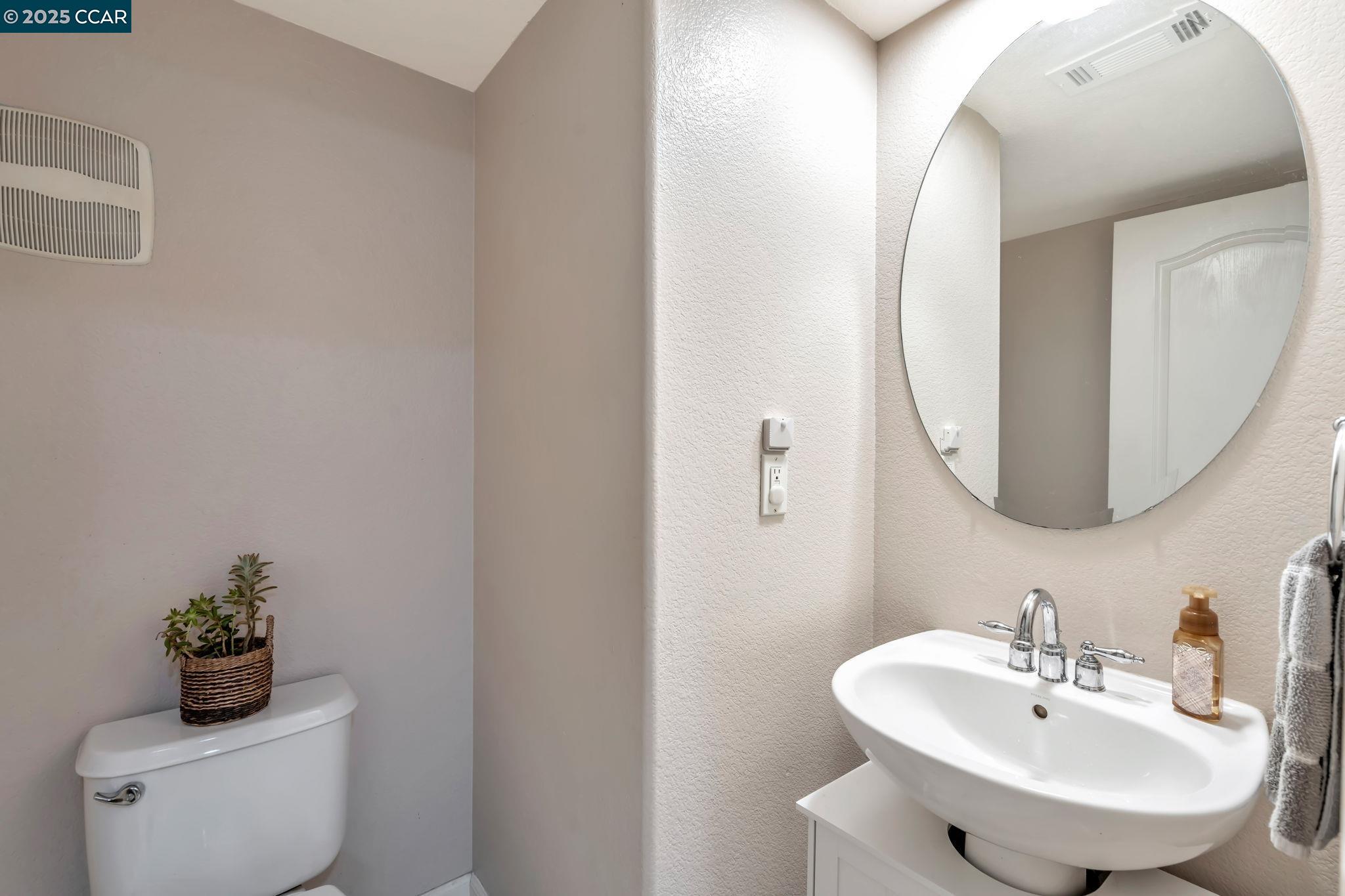 2036 Serra Lane Hercules, CA 94547 - Photo 20 of 60 a bathroom with a sink and a mirror