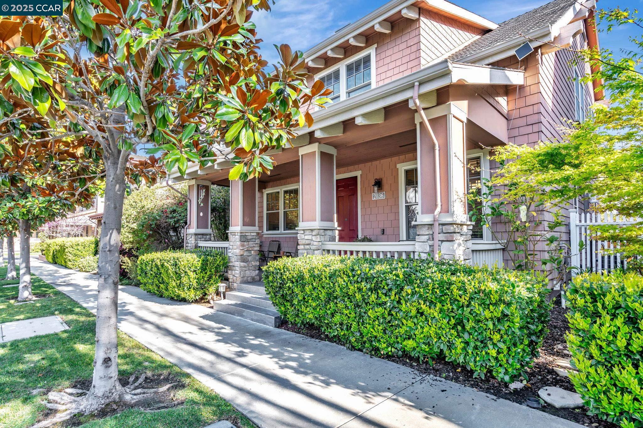 2036 Serra Lane Hercules, CA 94547 - Photo 2 of 60 a view of a house with brick walls plants and large tree