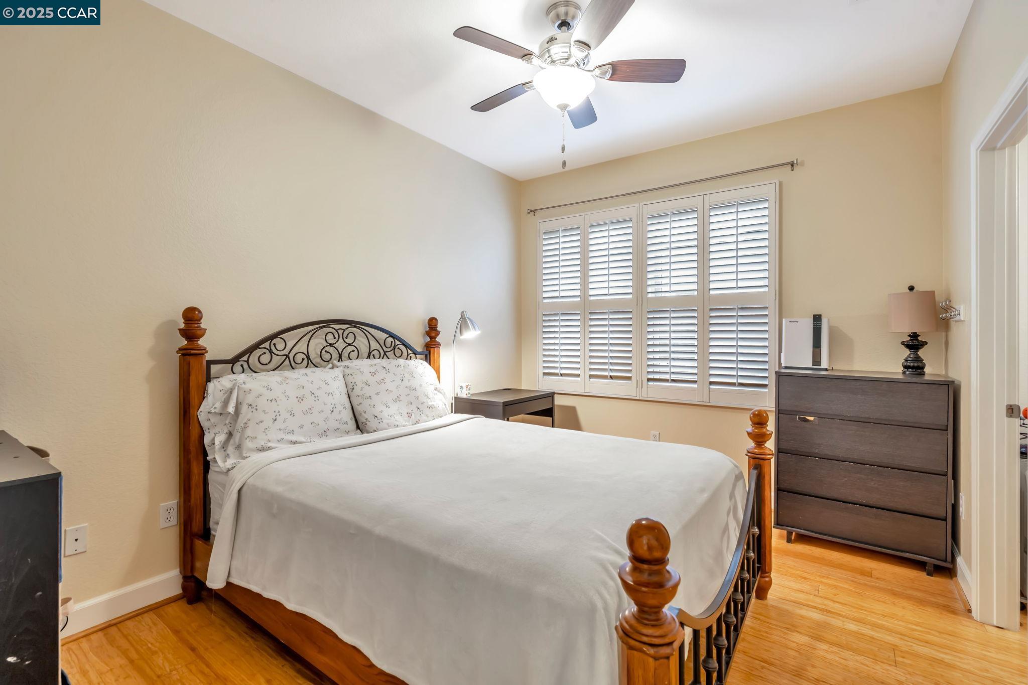 2036 Serra Lane Hercules, CA 94547 - Photo 27 of 60 a bedroom with a bed and a chandelier