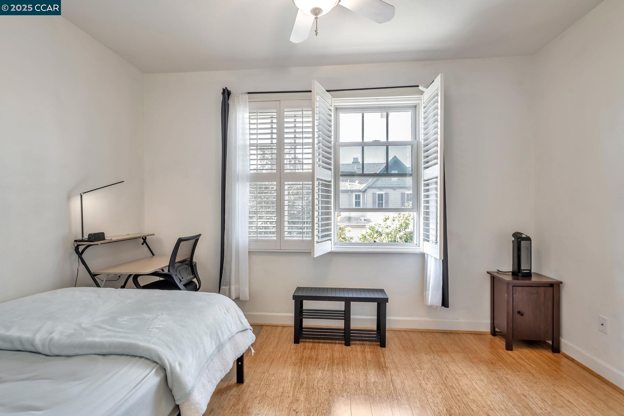 2036 Serra Lane Hercules, CA 94547 - Photo 32 of 60 a bedroom with a bed and a window