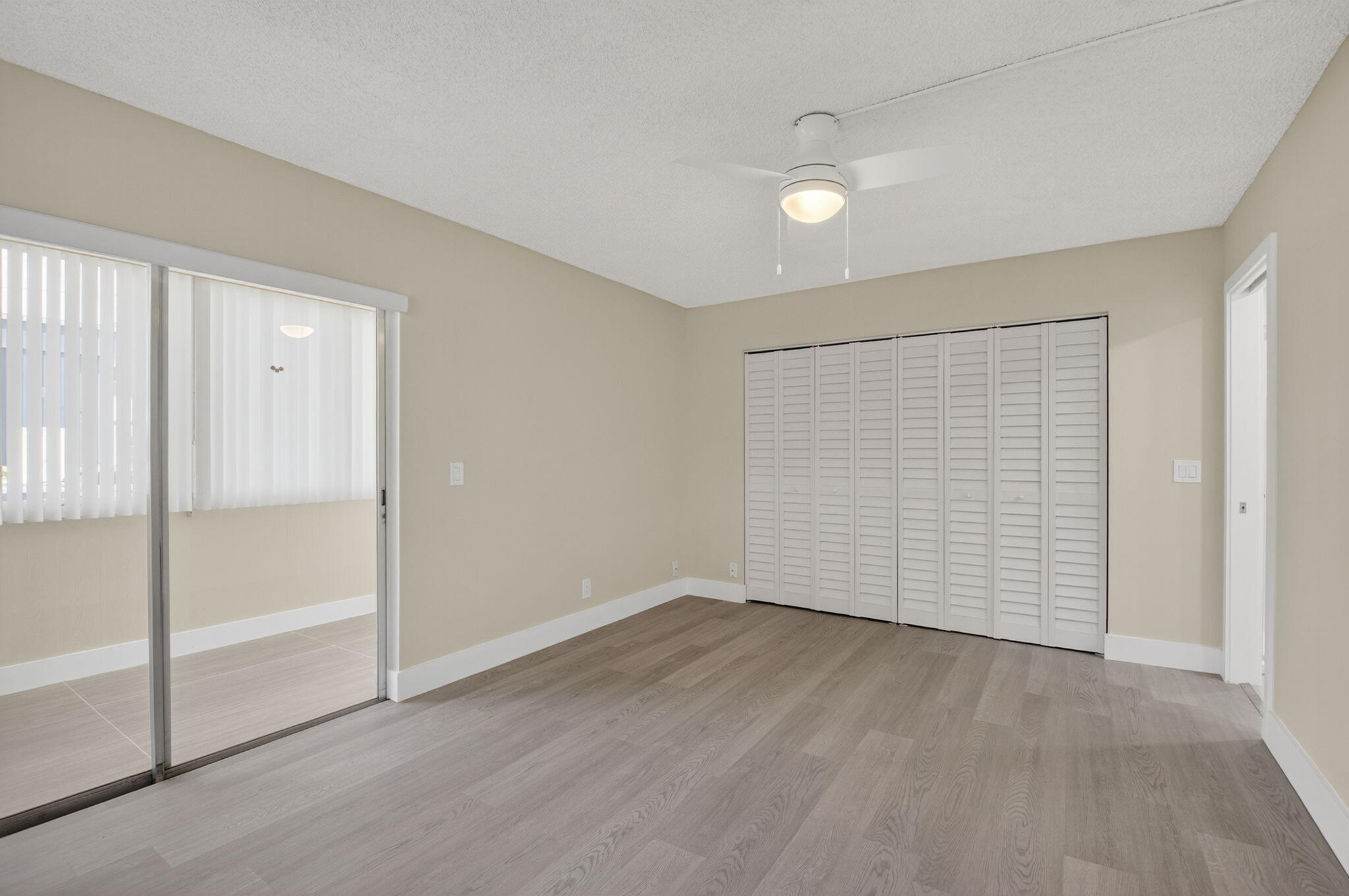 538 Normandy Lane Delray Beach, FL 33484 - Photo 11 of 66 an empty room with wooden floor