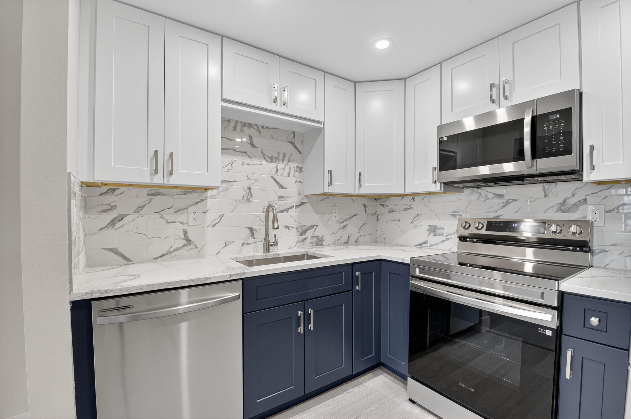 538 Normandy Lane Delray Beach, FL 33484 - Photo 2 of 66 a kitchen with stainless steel appliances granite countertop a sink stove and microwave