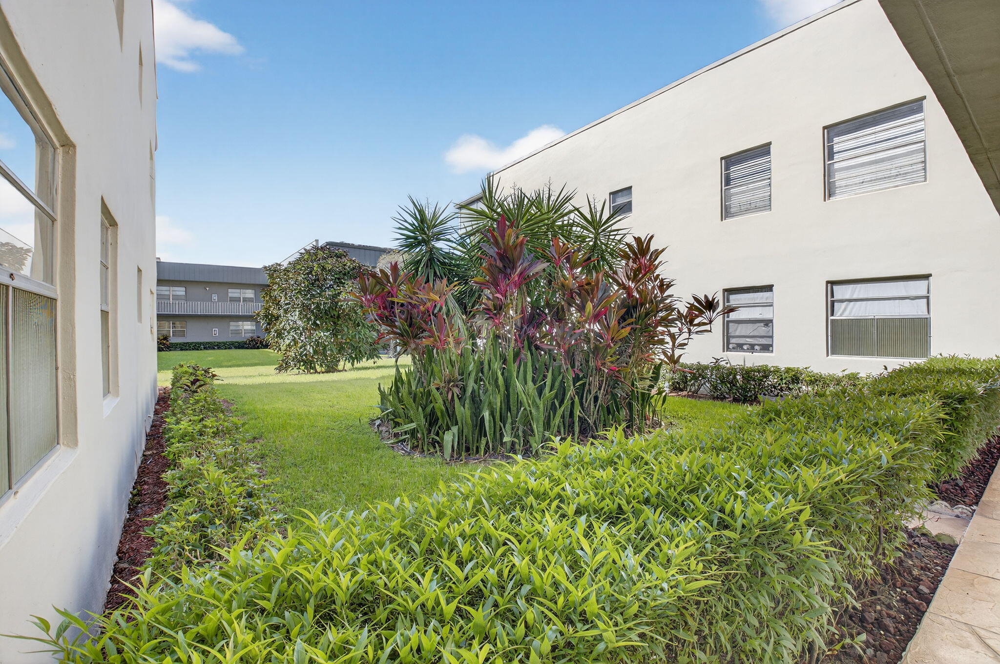 538 Normandy Lane Delray Beach, FL 33484 - Photo 23 of 66 a view of a back yard of the house