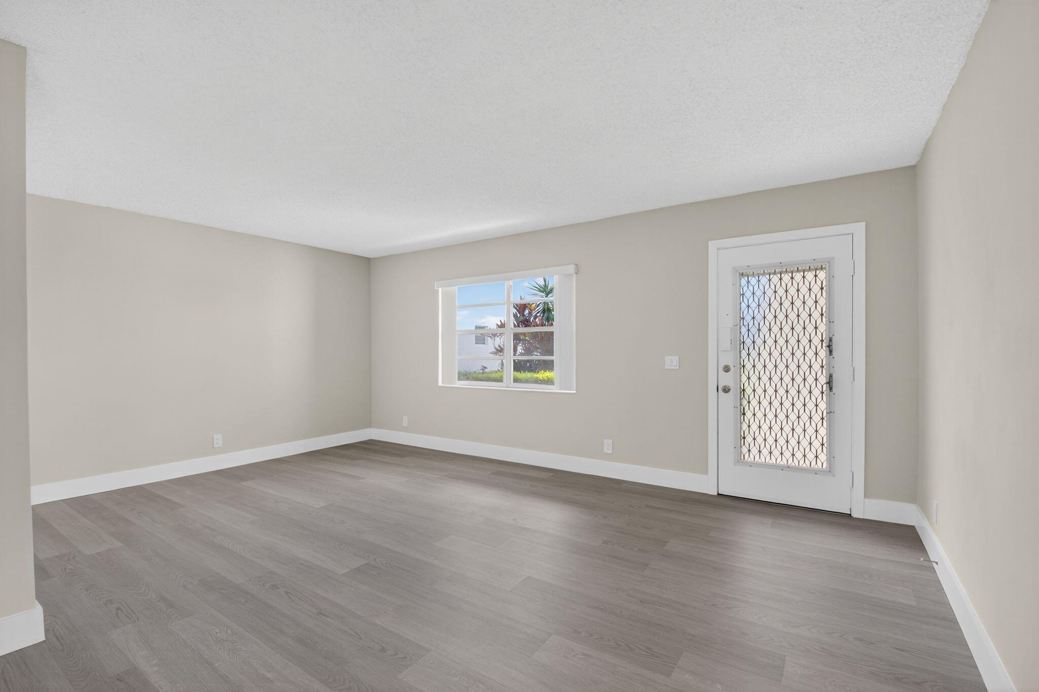 538 Normandy Lane Delray Beach, FL 33484 - Photo 4 of 66 an empty room with windows
