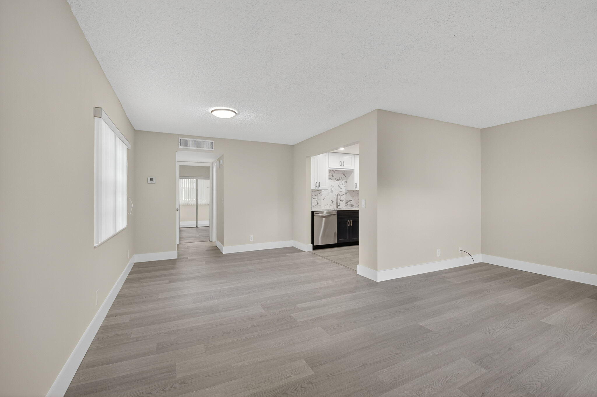538 Normandy Lane Delray Beach, FL 33484 - Photo 6 of 66 a view of an empty room with a window and fireplace