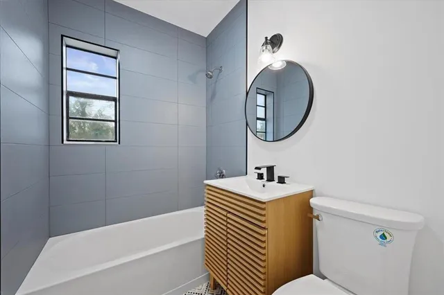 a bathroom with a sink toilet and a bathtub