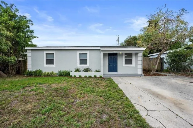 a front view of house with yard and green space