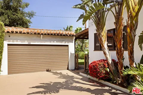 a view of a house with a tree