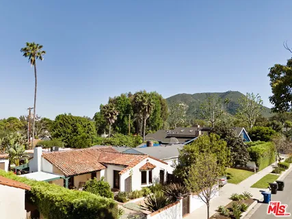 an aerial view of a house with a garden