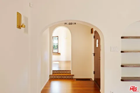 a view of entryway with wooden floor