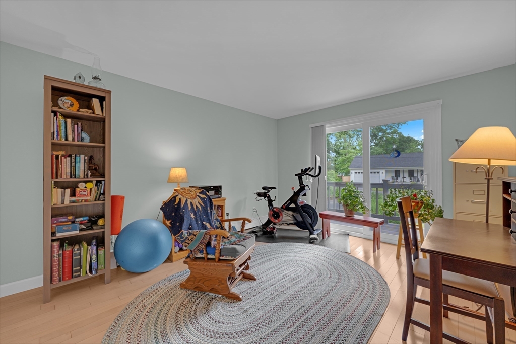 47 Horseshoe Circle Ware, MA 01082 - Photo 20 of 37 a living room with furniture a bookshelf and a large window
