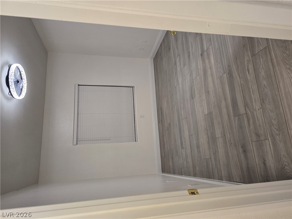1881 West Alexander Road, Unit 1127 North Las Vegas, NV 89032 - Photo 17 of 20 Newly installed wood flooring creates an inviting and refined atmosphere in this versatile room.
