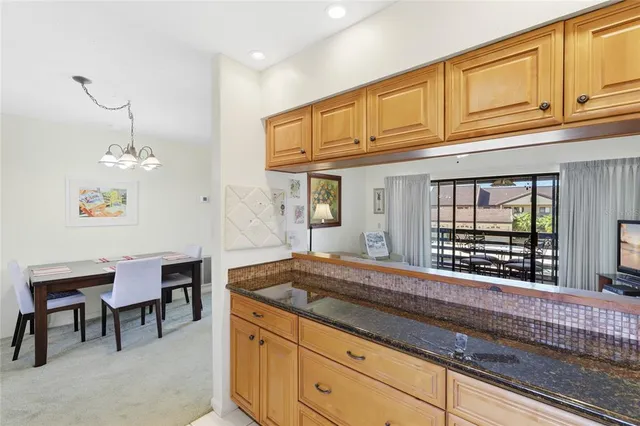 a kitchen with sink and cabinets