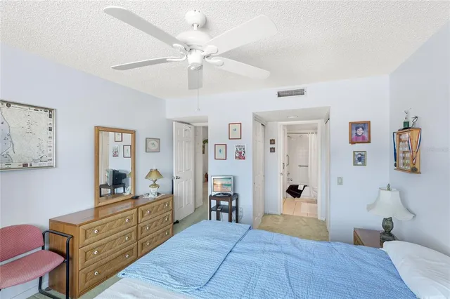 a bathroom with a sink a toilet a mirror and shower