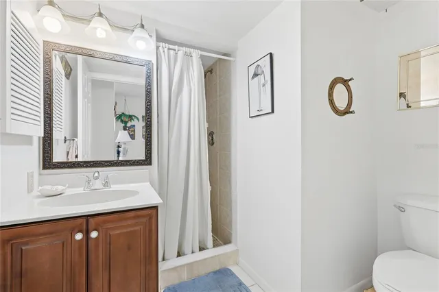 a bedroom with bed and a table