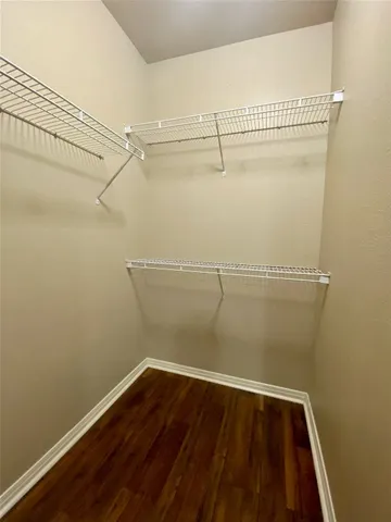 a view of a room with racks on the wall