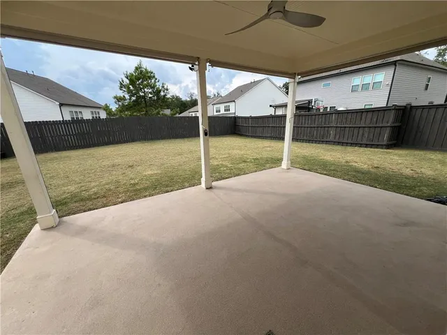 a kitchen with stainless steel appliances a refrigerator sink and cabinets