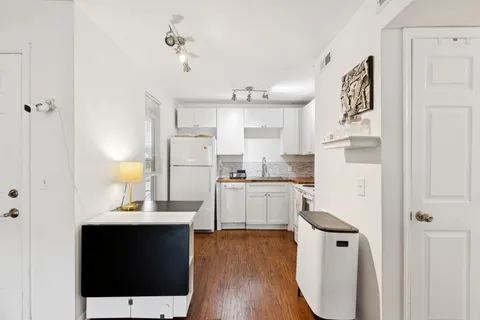 a view of kitchen with wooden floor