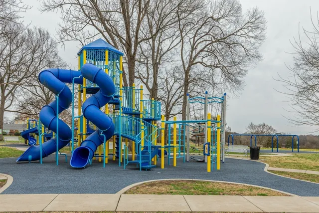 a view of a parking space with lots of trees