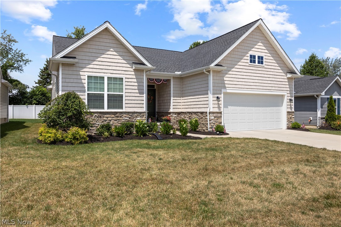 109 West Spring Drive Elyria, OH 44035 - Photo 2 of 46 Craftsman-style home featuring shake siding and stone veneer accents