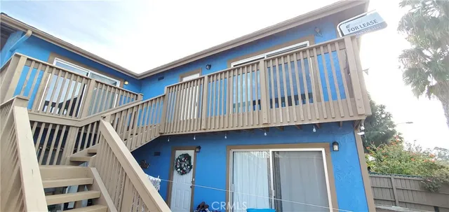 a view of entryway with wooden stairs