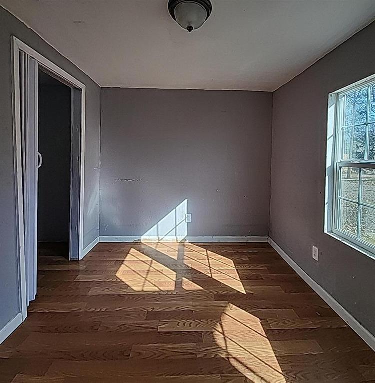 108 Monroe Street Cleburne, TX 76033 - Photo 11 of 14 a bedroom with a bed and window