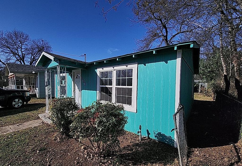 108 Monroe Street Cleburne, TX 76033 - Photo 2 of 14 a front view of a house with garden
