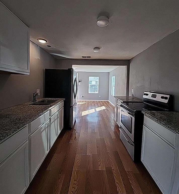 108 Monroe Street Cleburne, TX 76033 - Photo 9 of 14 a kitchen with a sink and steel appliances
