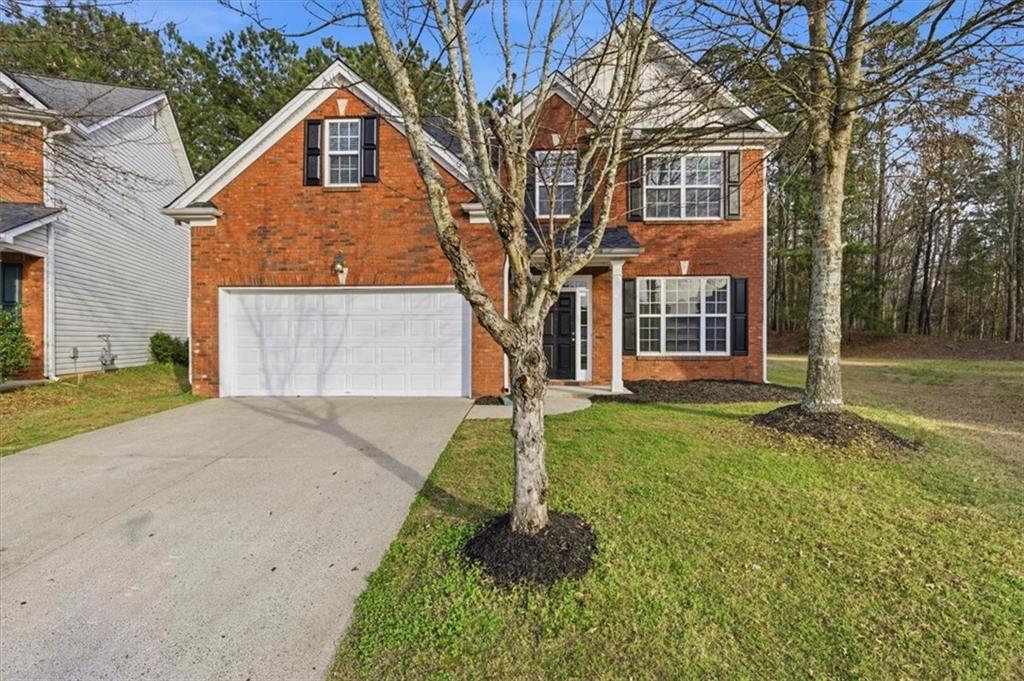 front view of a house with a yard
