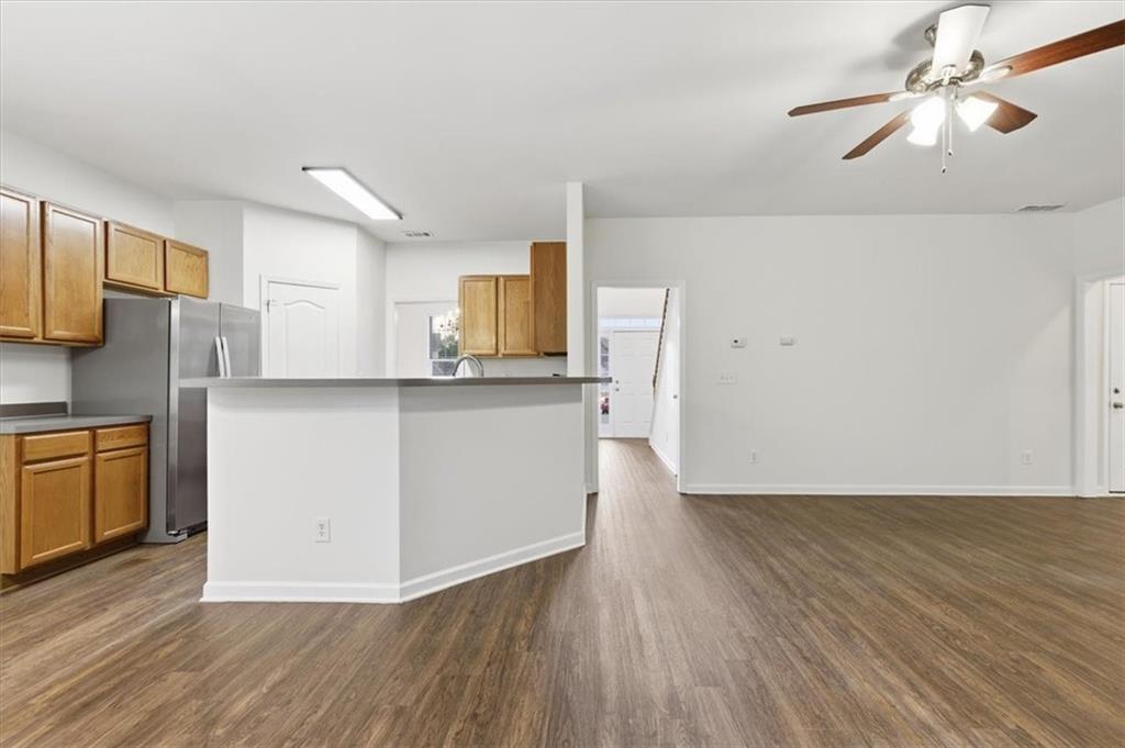 836 Topaz Valley Canton, GA 30114 - Photo 16 of 33 a view of kitchen with wooden floor electronic appliances and window