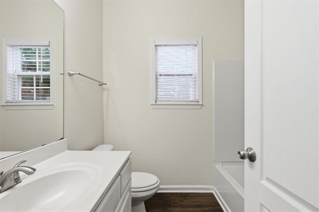 836 Topaz Valley Canton, GA 30114 - Photo 17 of 33 a bathroom with a sink toilet and window