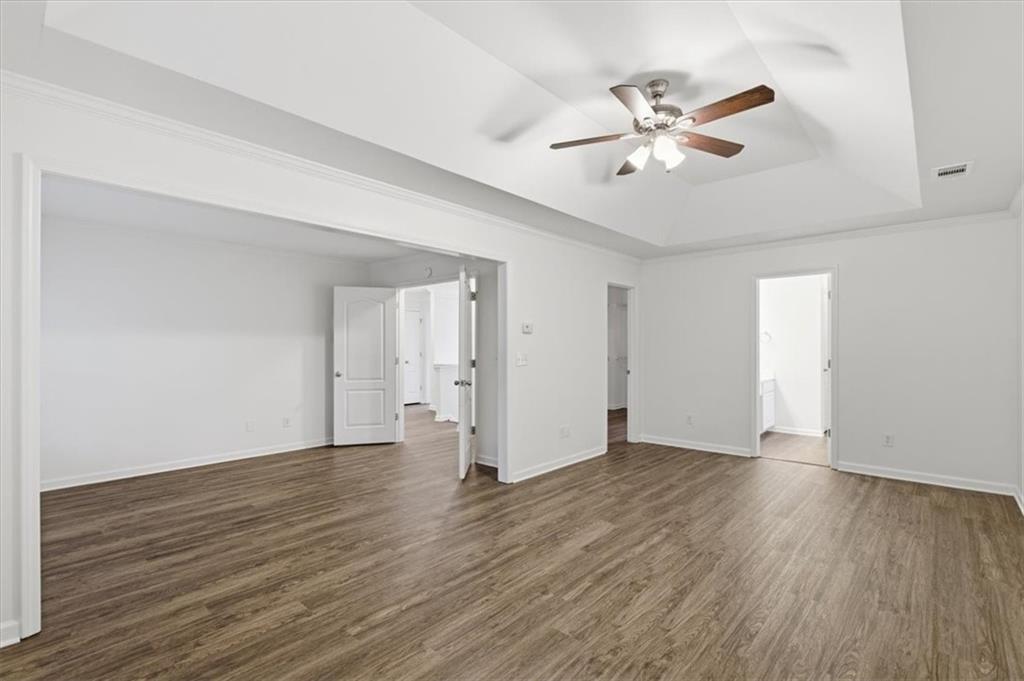 836 Topaz Valley Canton, GA 30114 - Photo 20 of 33 a view of an empty room with wooden floor
