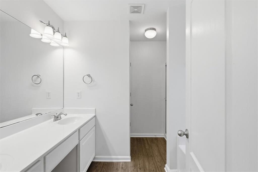 836 Topaz Valley Canton, GA 30114 - Photo 21 of 33 a bathroom with a double vanity sink a mirror and shower