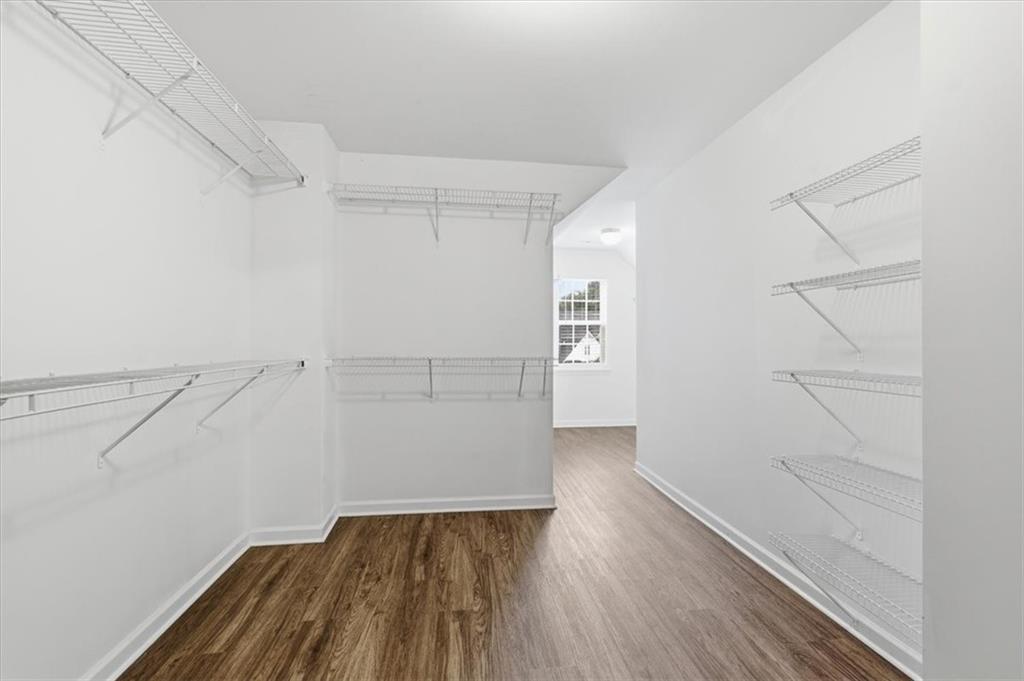 836 Topaz Valley Canton, GA 30114 - Photo 24 of 33 a view of walk in closet with empty racks