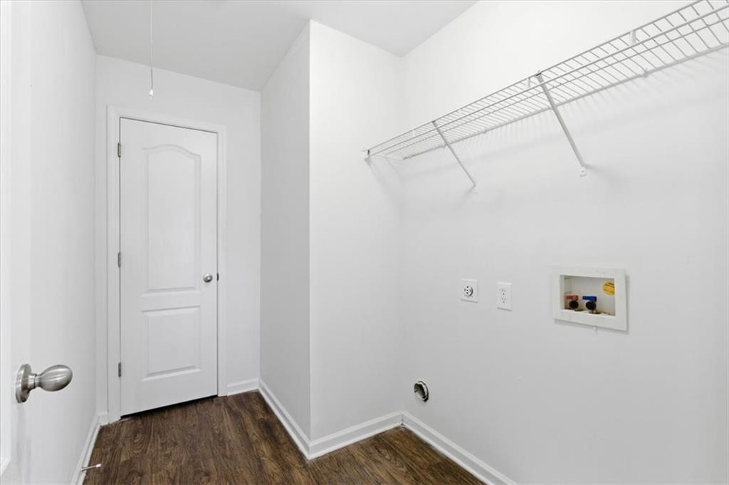 836 Topaz Valley Canton, GA 30114 - Photo 29 of 33 a view of a room with wooden floor and cabinet