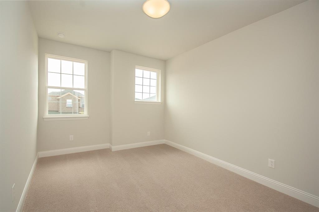 820 Portina Drive Anna, TX 75409 - Photo 18 of 25 an empty room with windows