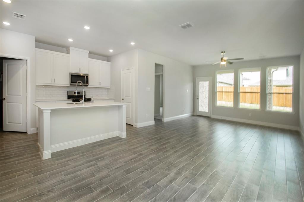 820 Portina Drive Anna, TX 75409 - Photo 7 of 25 a view of kitchen with sink and wooden floor