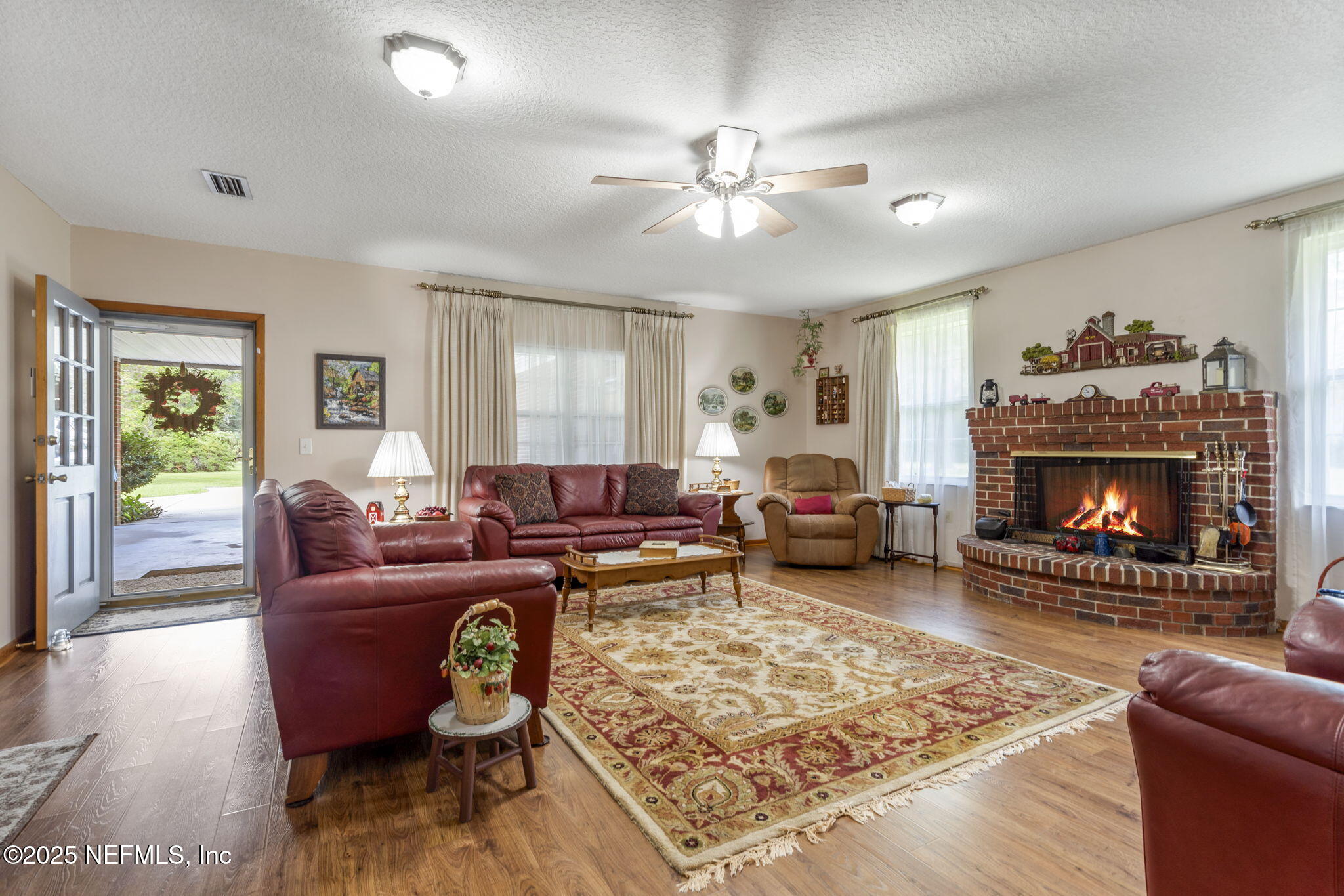 5893 George Hodges Road Macclenny, FL 32063 - Photo 12 of 56 a living room with furniture and a fireplace
