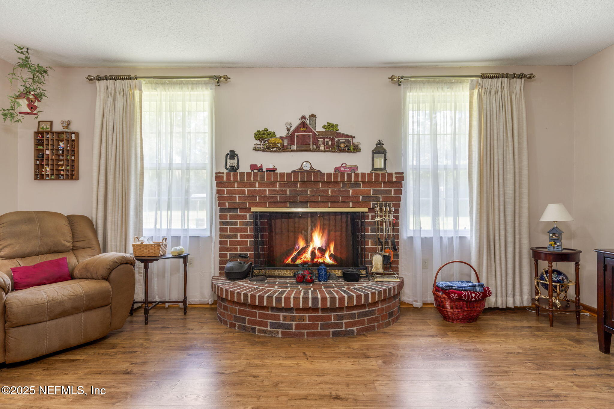 5893 George Hodges Road Macclenny, FL 32063 - Photo 13 of 56 a living room with furniture and a fireplace