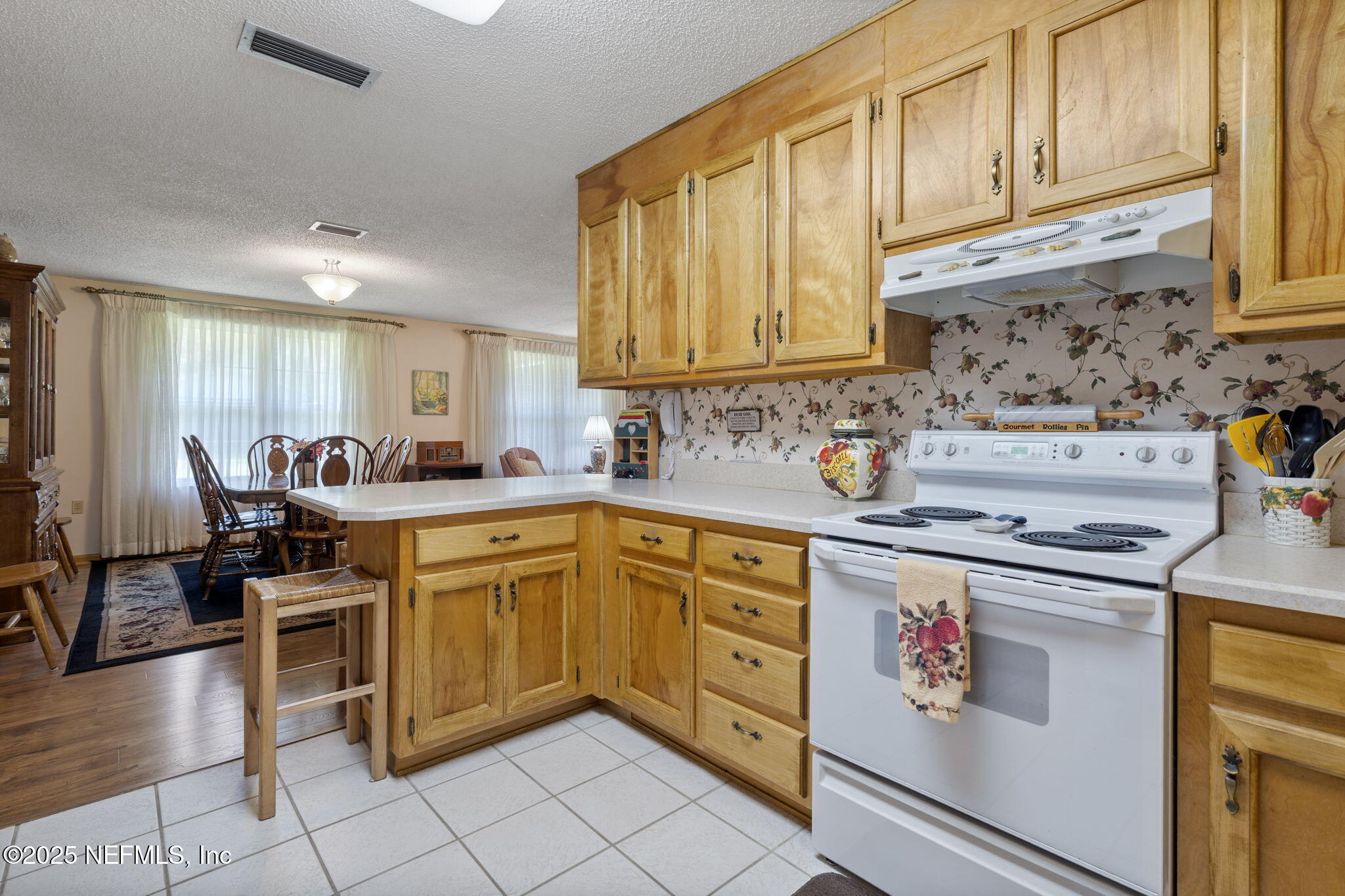 5893 George Hodges Road Macclenny, FL 32063 - Photo 18 of 56 a kitchen with stainless steel appliances granite countertop a sink and cabinets