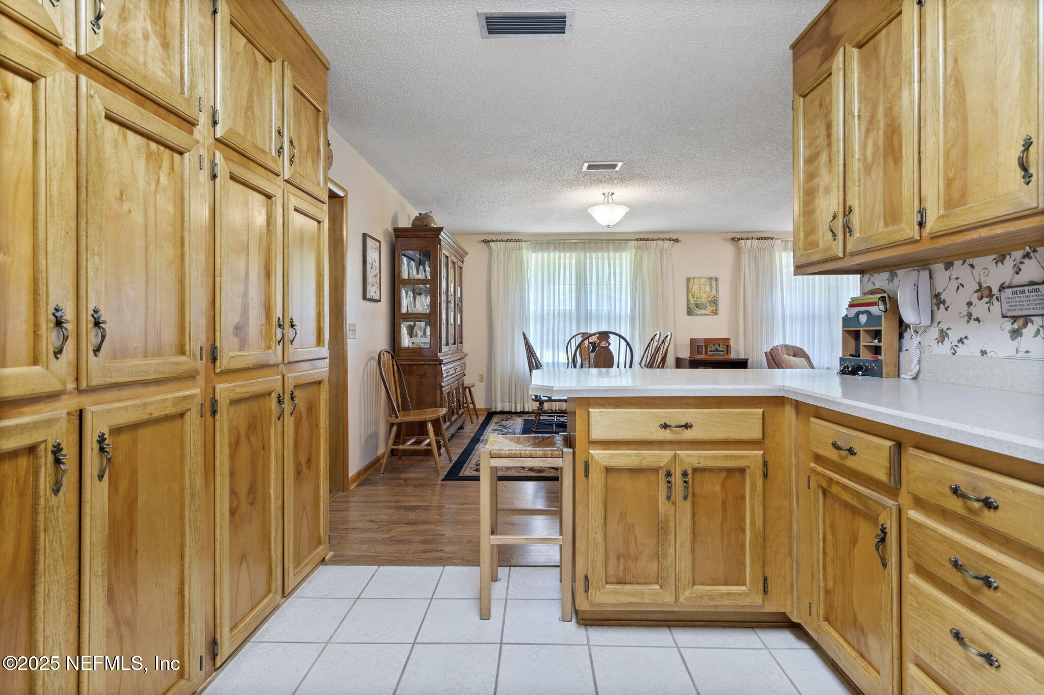 5893 George Hodges Road Macclenny, FL 32063 - Photo 19 of 56 a kitchen with cabinets appliances and a counter top space